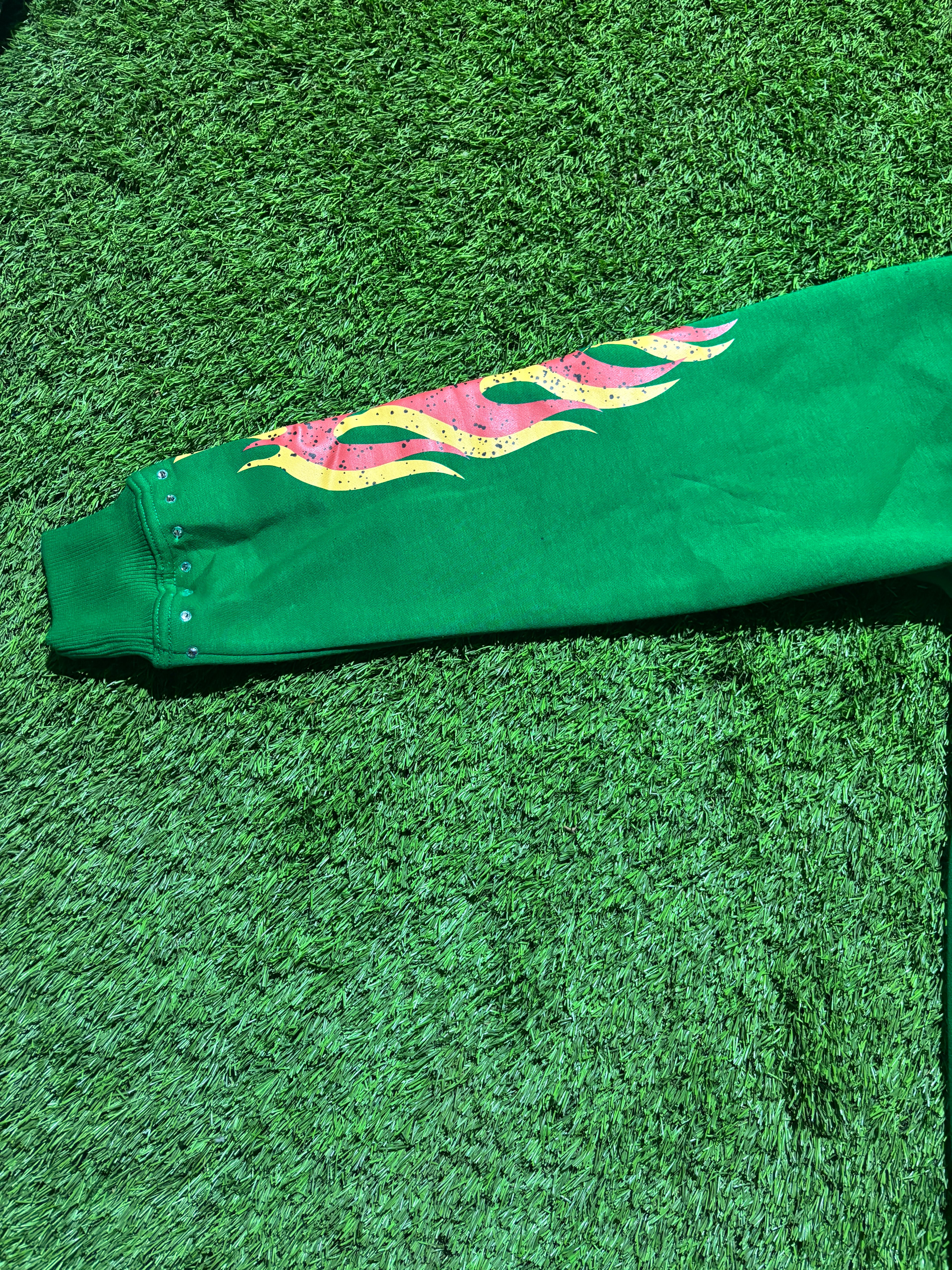 Base Green, with  Red & Yellow star designed jacket